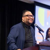 Dr. Shorty speaking at podium photo 2